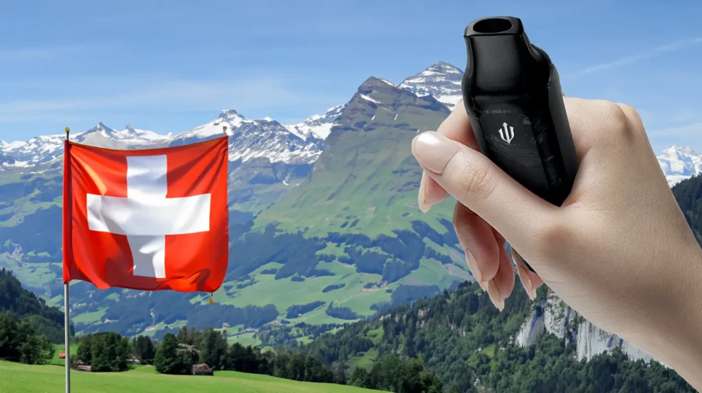 Main tenant une puff devant un paysage suisse avec un drapeau suisse en arrière-plan. 