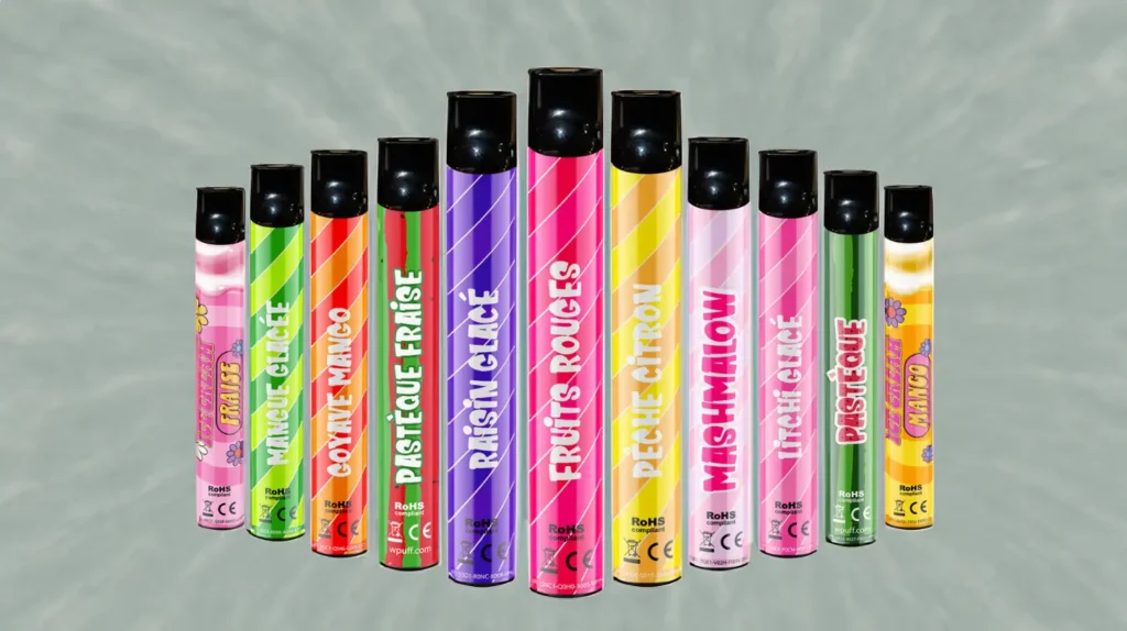 Une collection colorée de cigarettes électroniques jetables (puff) avec des saveurs variées comme pastèque fraise, mangue glacée, raisin glacé, fruits rouges, pêche citron et plus, représentant la question "1 7 de nicotine puff".