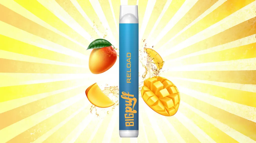 "Big Puff Reload saveur mangue sur fond rayonnant jaune" - Une puff Big Puff Reload bleue est entourée de morceaux de mangue éclatants et juteux, avec des éclaboussures de jus, sur un fond jaune rayonnant. L'image évoque la fraîcheur et la vivacité de la saveur de mangue offerte par cette puff.